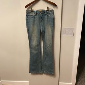 Vintage boot cut low-rise jeans with great embroidered detail.